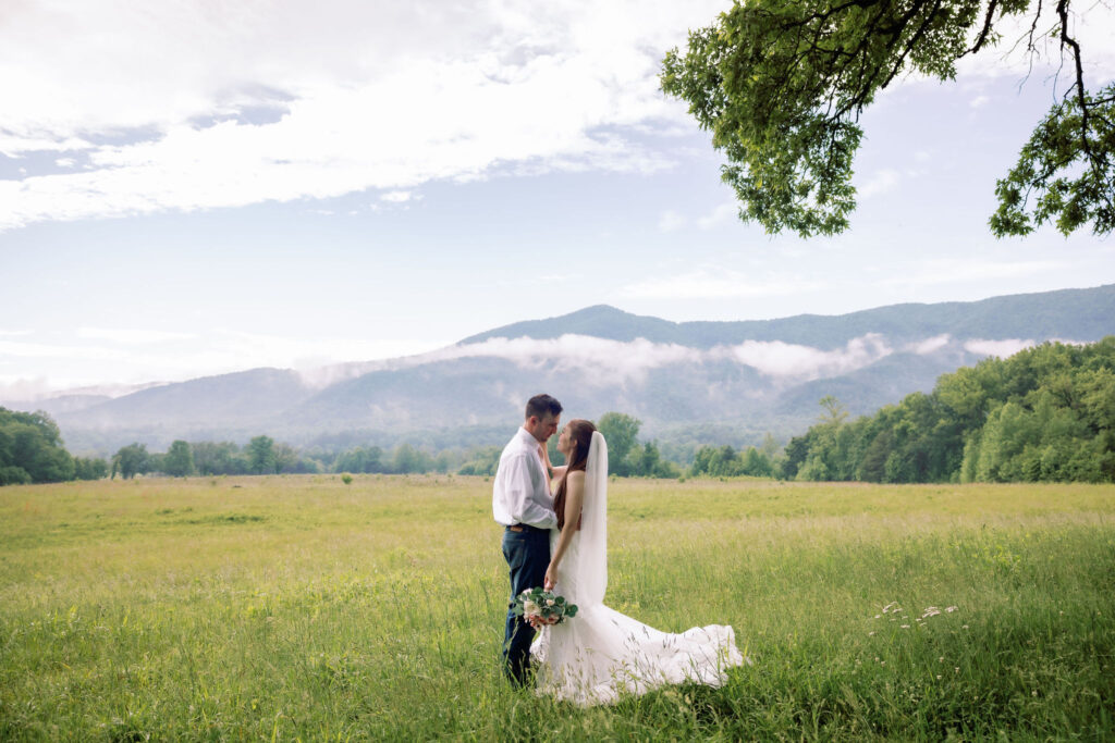 cades cove ceremony in the spring on a semi-rainy day with thick clouds rolling over the meadow