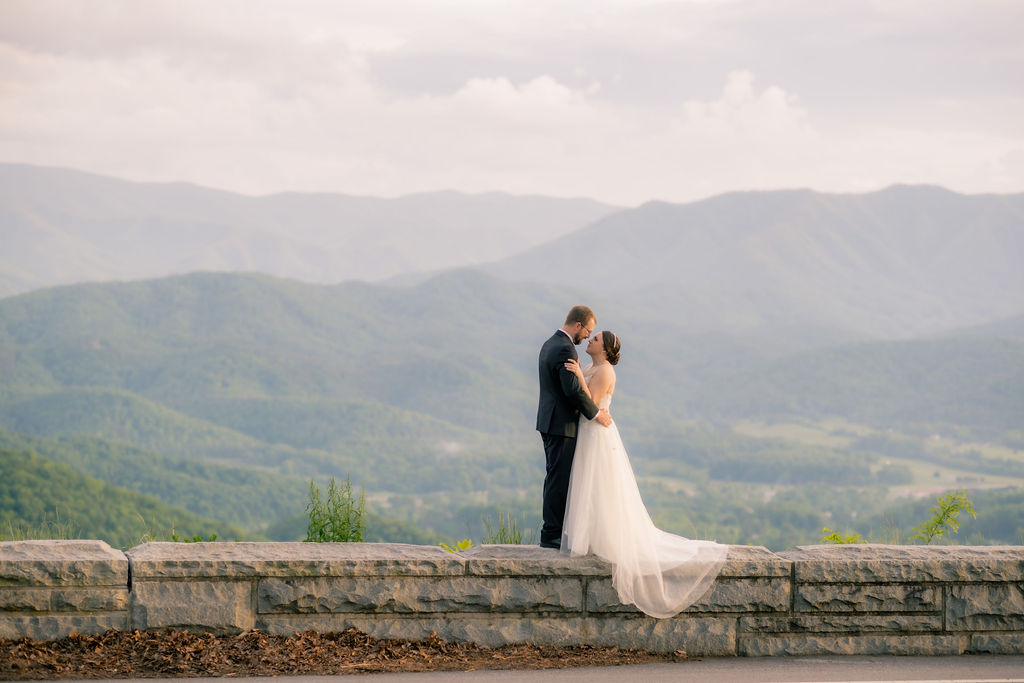 eloping to Gatlinburg couple kisses on the foothills parkway in the Smokies