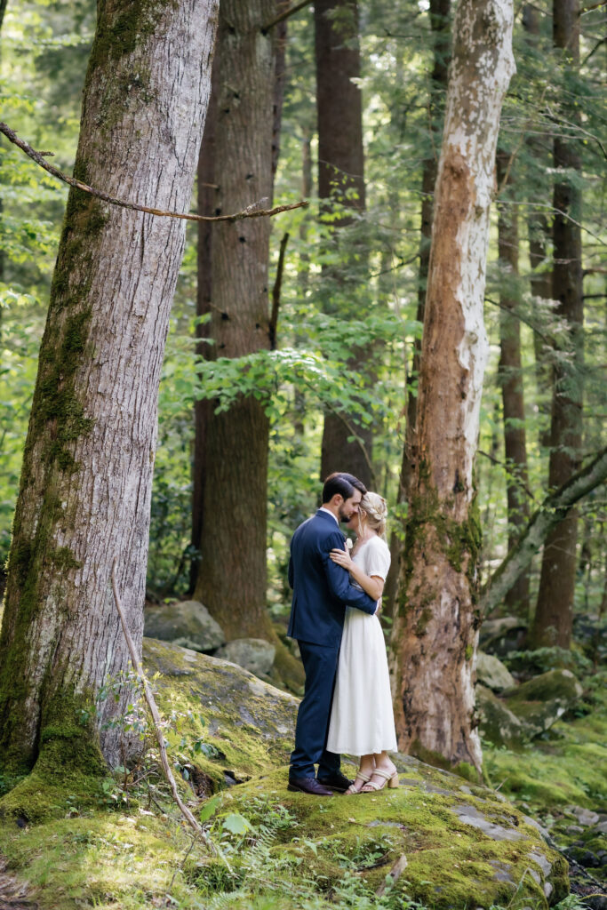 woodland wedding pictures with bride and groom dancing in the woods near Spence Cabin as they elope to Gatlinburg